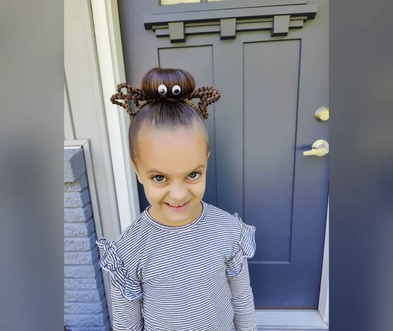 Little girl's spider bun with googly eyes, a sweet idea from halloween hairstyles for girls