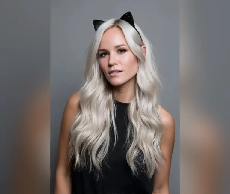 Platinum waves with a black cat-ear headband, an easy halloween hairstyles look that takes five minutes