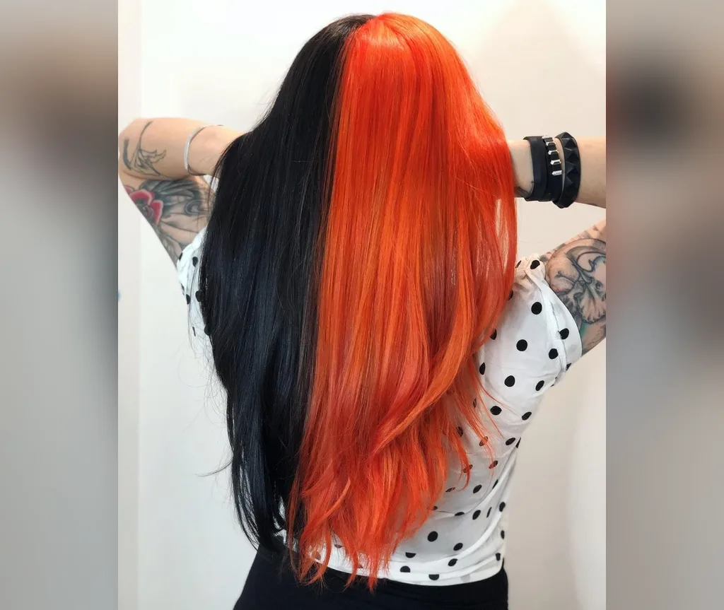 Split black and orange straight hair in halloween hair color ideas