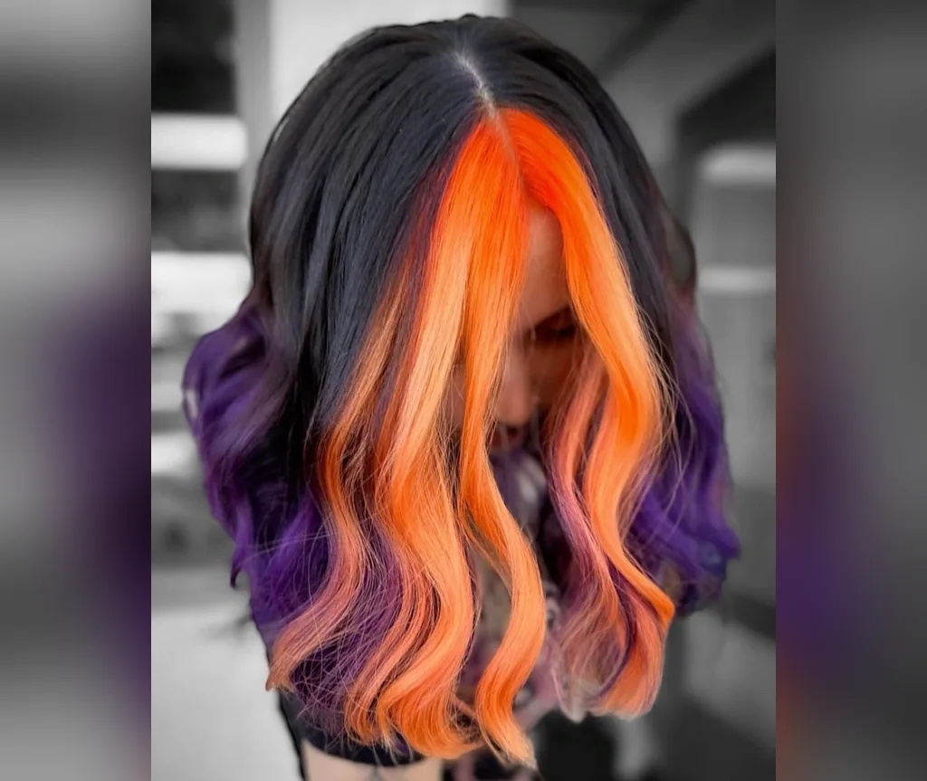 Orange money piece on a black lob in halloween hair color ideas