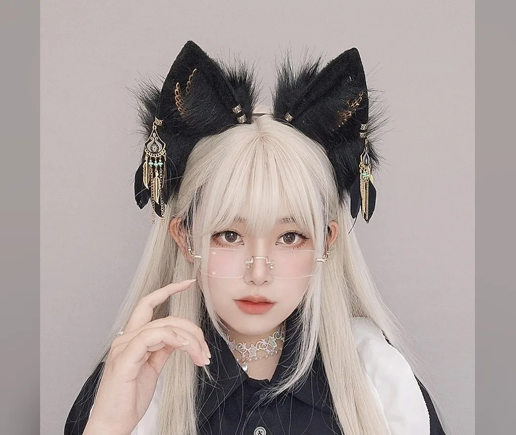 Ornate black cat ears with gold charms on platinum hair with bangs, five-minute Halloween style
