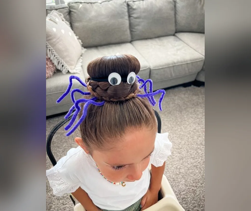 Single spider bun with wiggly googly eyes, fun halloween hairstyles for girls