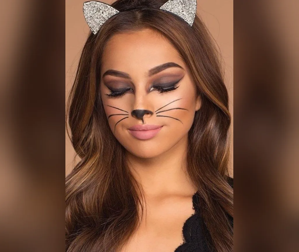 Rhinestone cat ears with long brown waves and cat makeup for a quick Halloween party look