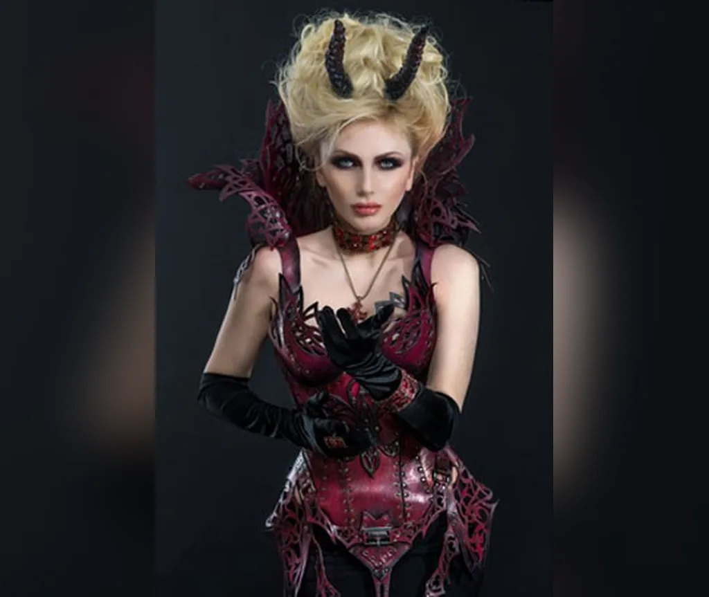 Blonde curled updo with small black horns, fantasy-inspired halloween hairstyles for women