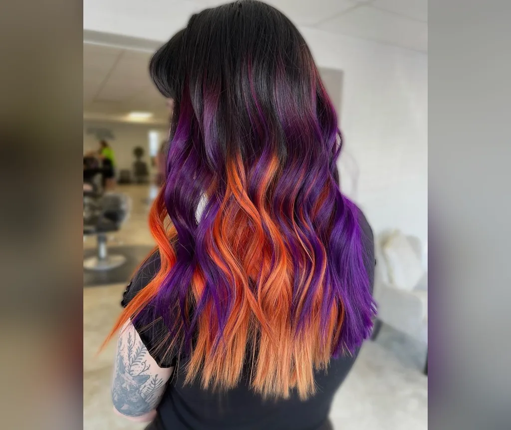 Purple to orange ombre waves in halloween hair color ideas