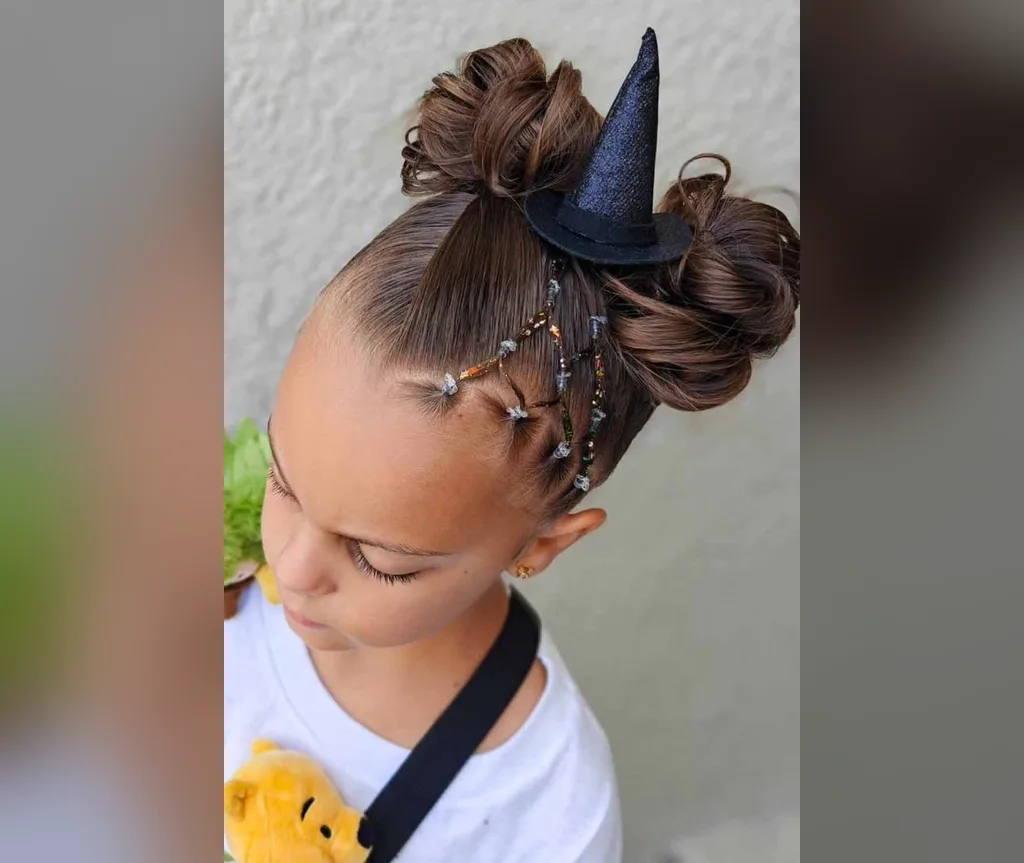 Double buns topped with tiny witch hats, magical halloween hairstyles for girls