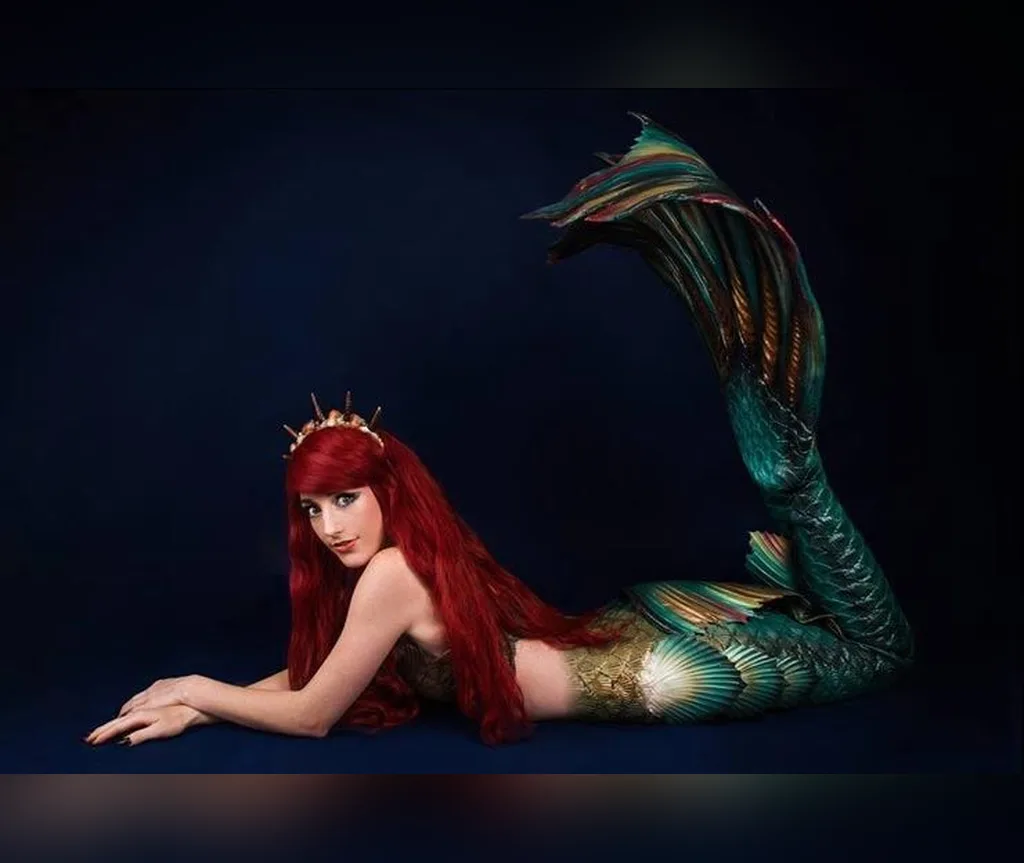 Mermaid lying down with very long red hair spread around her, fantasy halloween hair for long hair