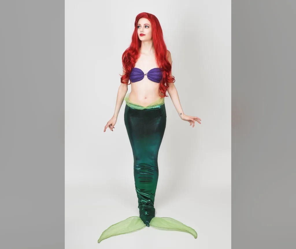 Full figure mermaid with flowing long red waves matching her tail, show-stopping halloween hairstyles for long hair