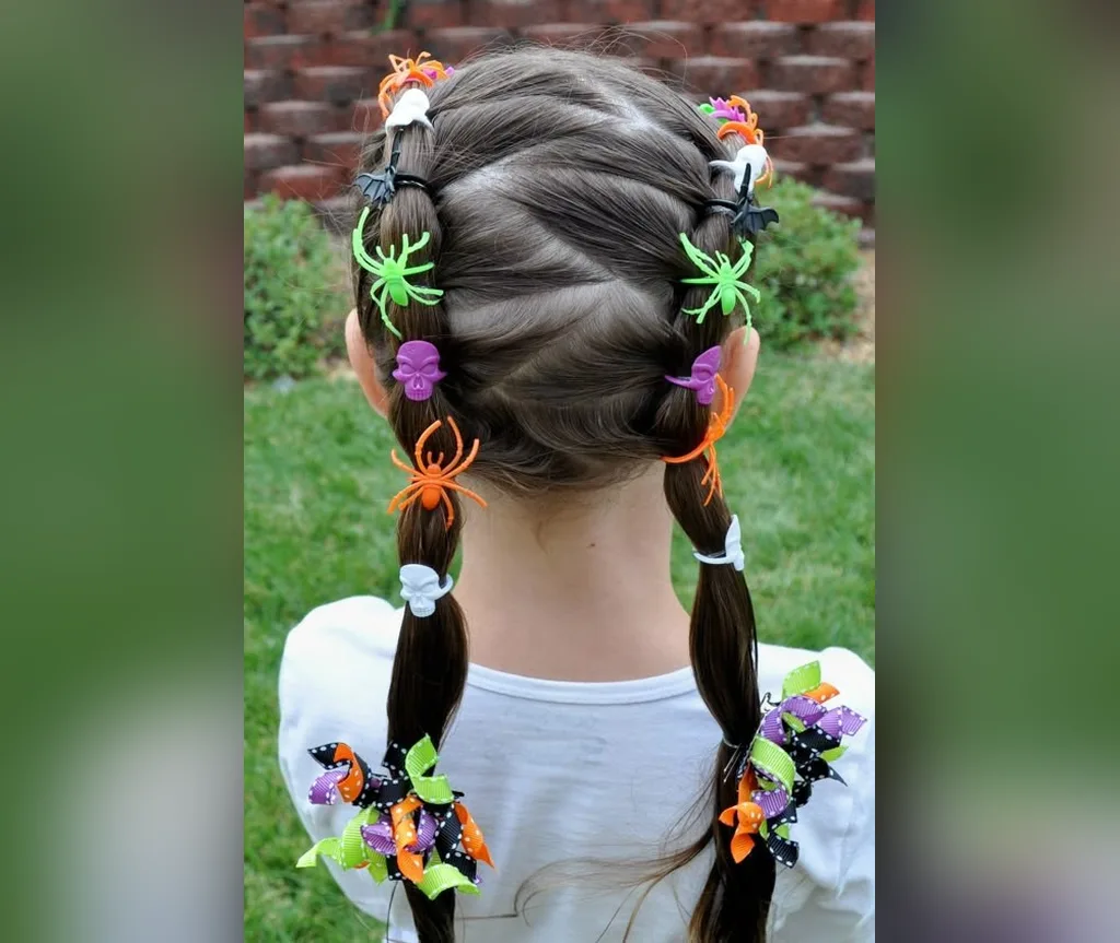 Back view of two braids loaded with Halloween spider clips and bows, halloween hairstyles for girls