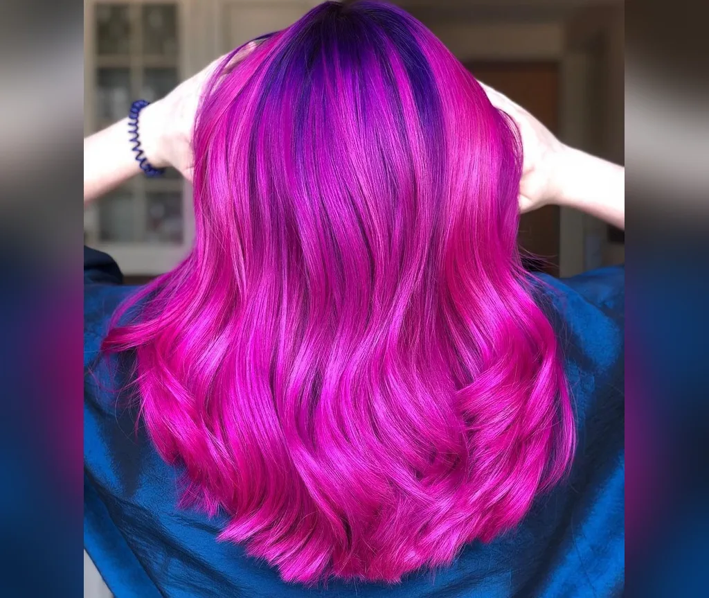 Magenta waves from the back in halloween hair color ideas