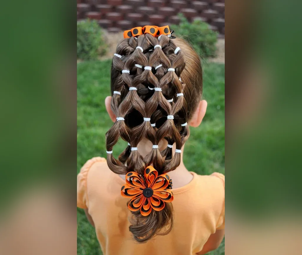 Intricate spiderweb lattice hairstyle with an orange flower, halloween hairstyles for girls