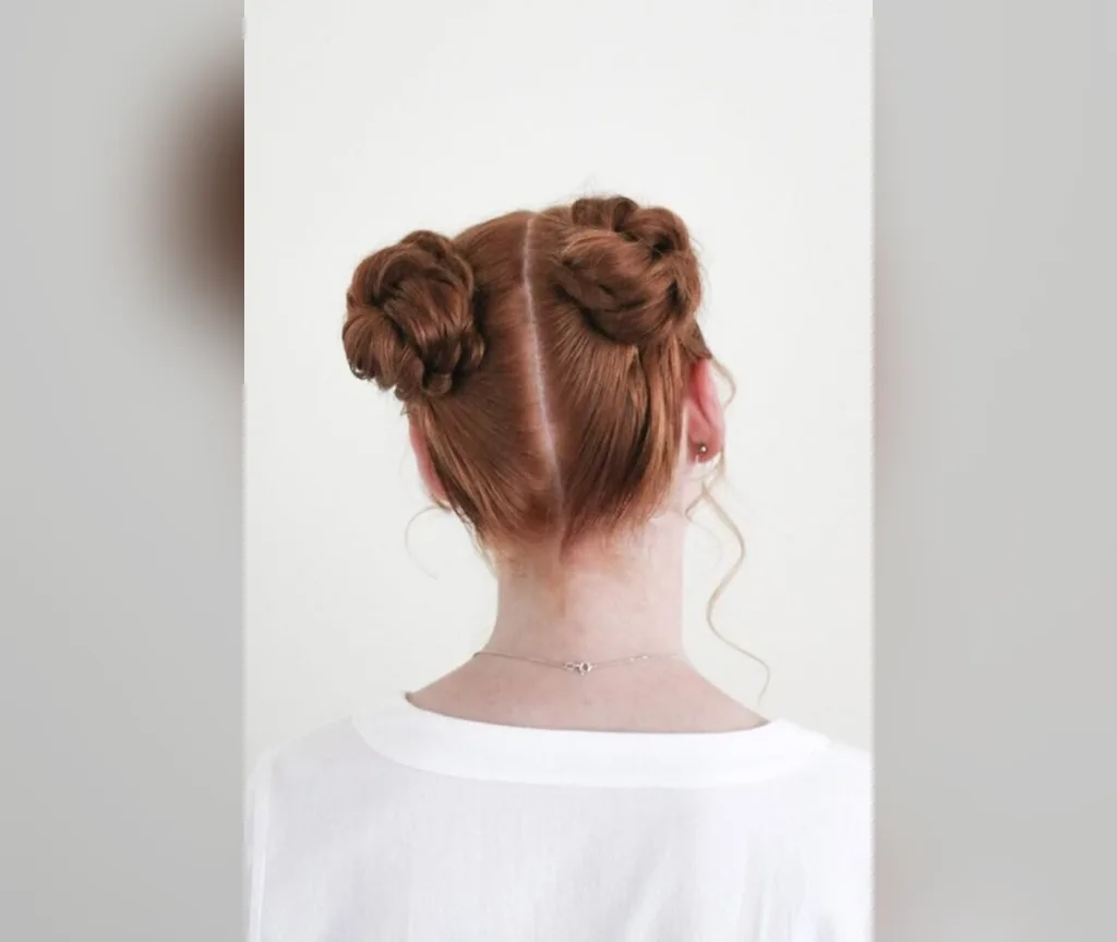 Red braided space buns seen from the back, textured easy halloween hairstyle