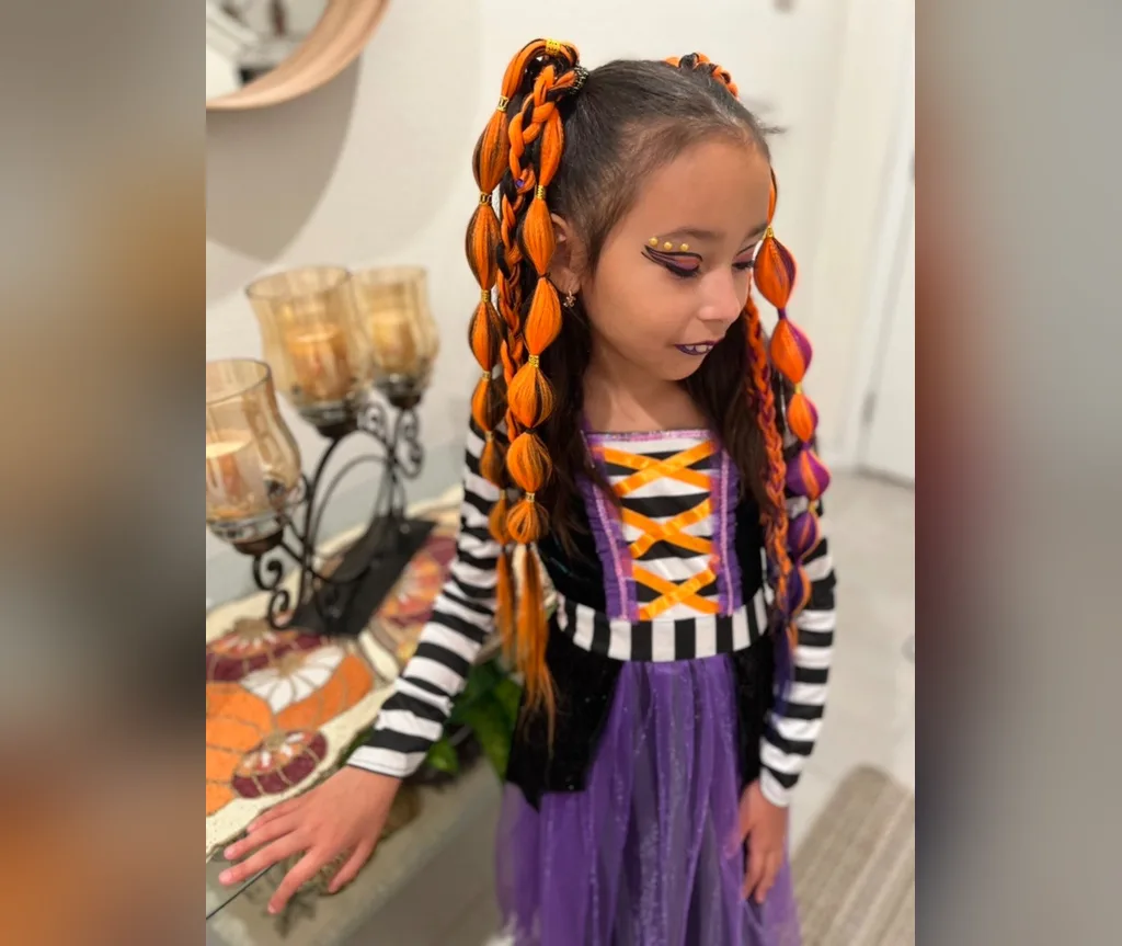 Orange bubble braids styled with a witch costume, halloween hairstyles for girls