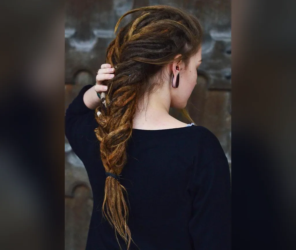 Side view of a long fishtail braid with dread texture, bohemian halloween hairstyles for long hair