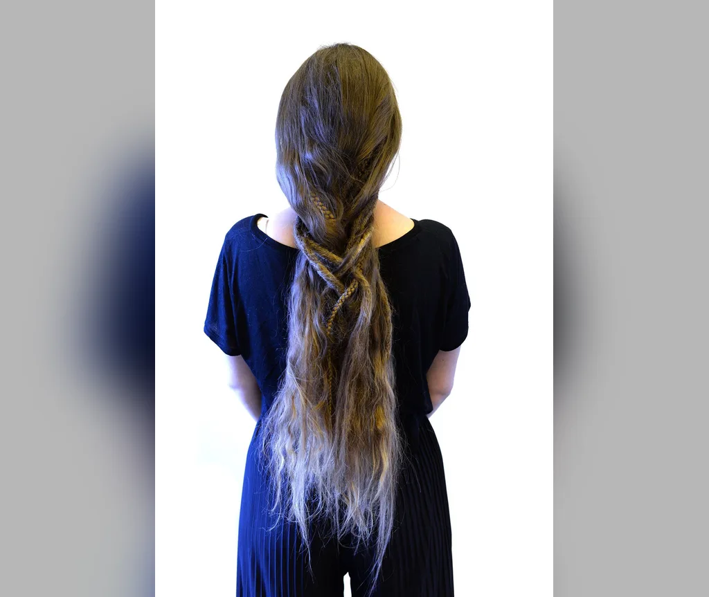 Long loose fishtail braid in grey green tones down the back, sea ghost halloween hair for long hair