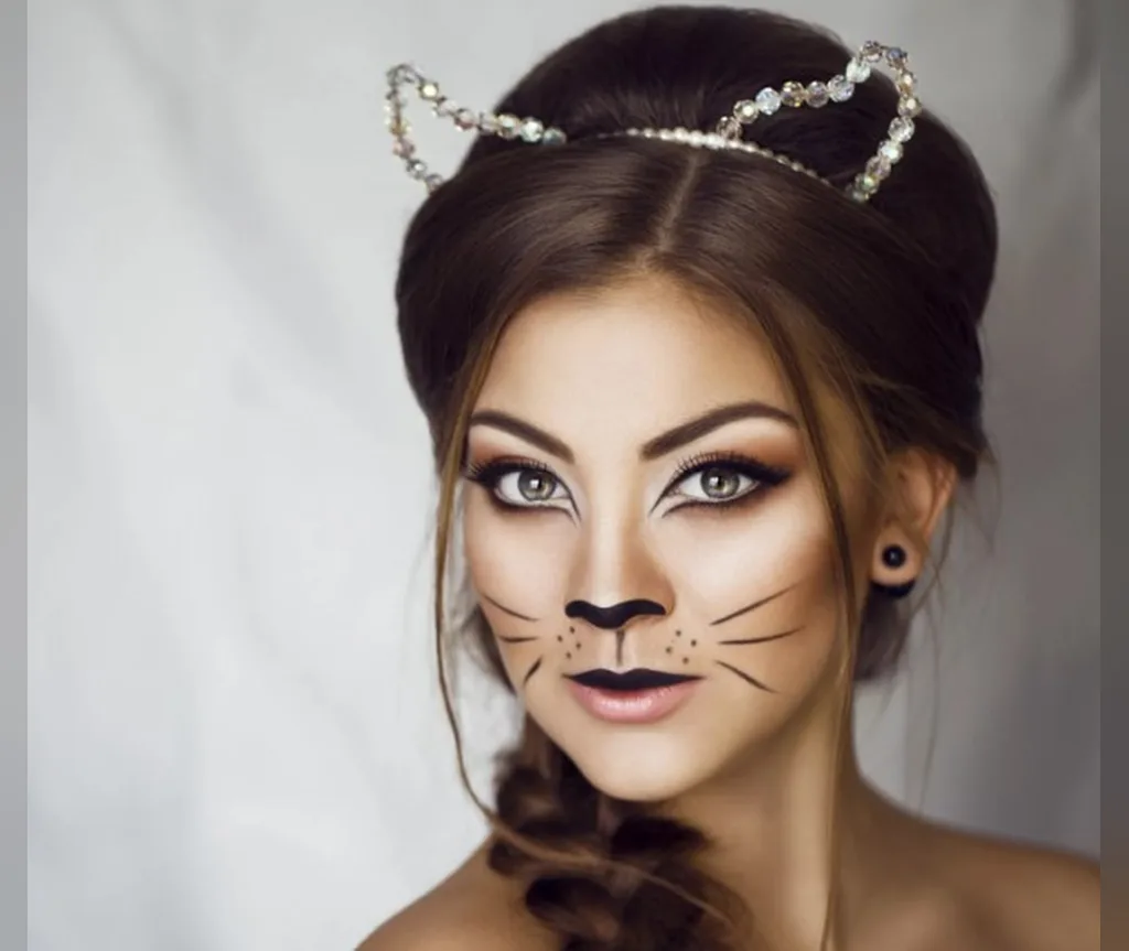 Elegant updo with a crystal cat-ear crown, side braid and cat makeup, dressy halloween hairstyle