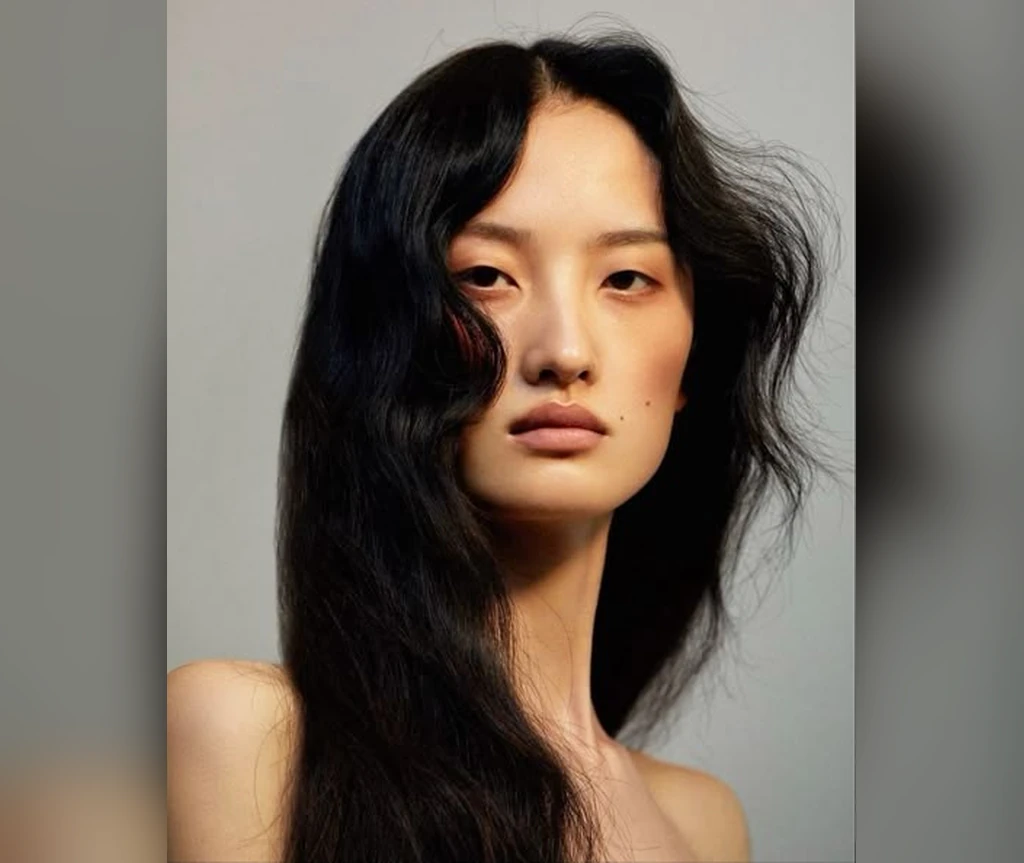 Windblown midnight black hair in motion