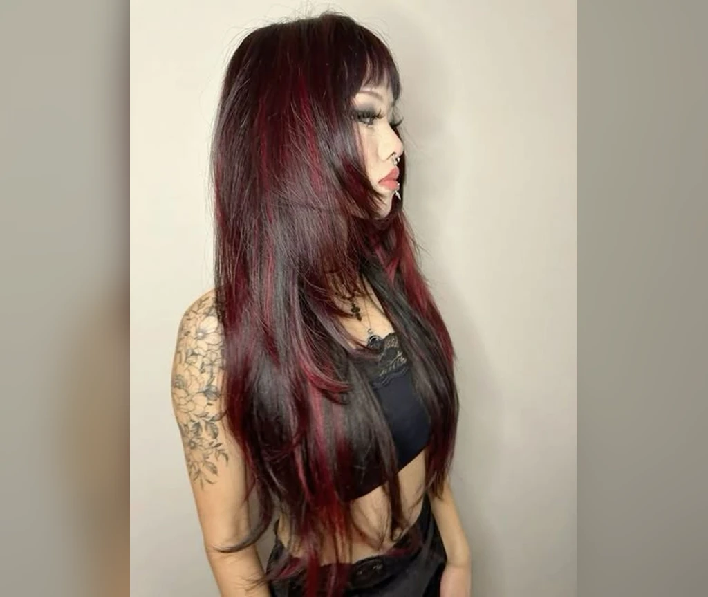 Deep burgundy side-swept long hair