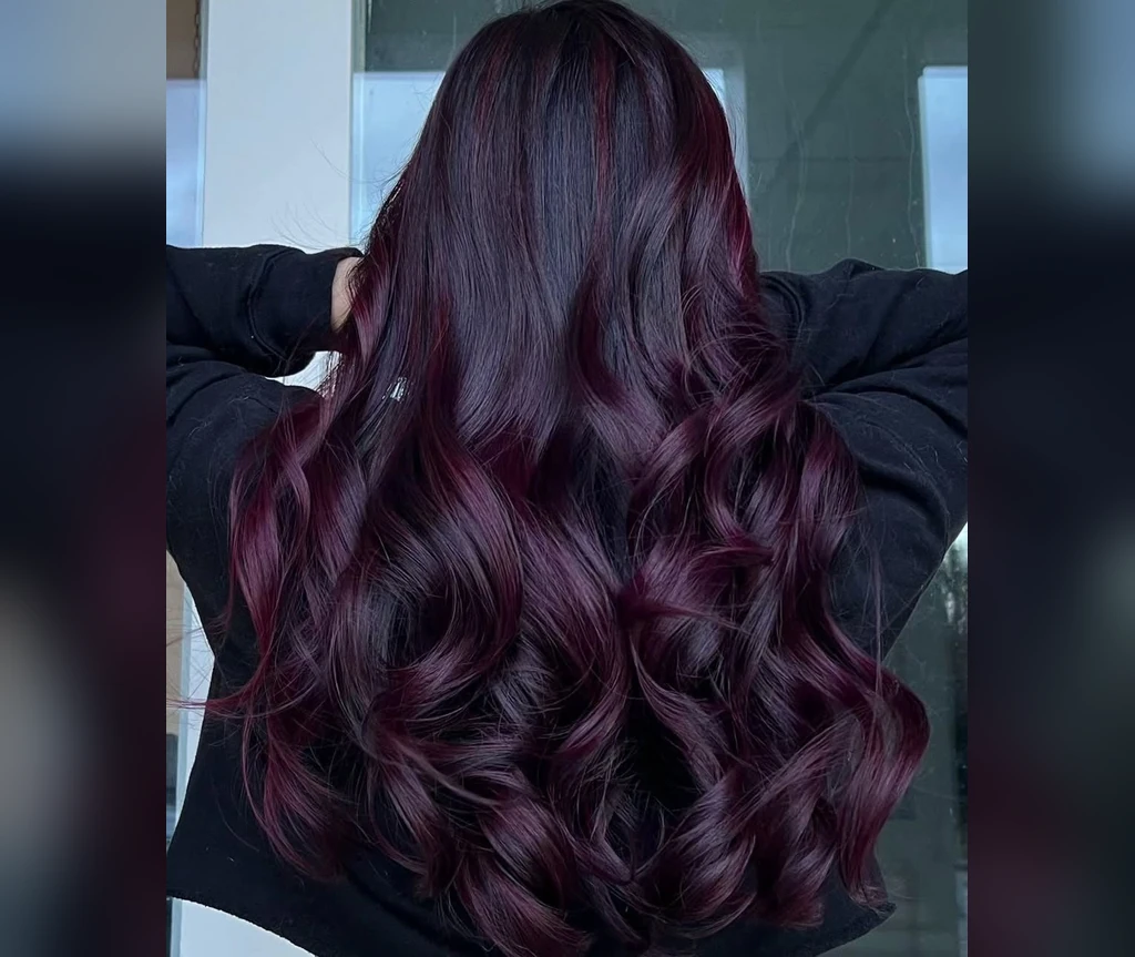 Midnight plum waves in long glossy hair