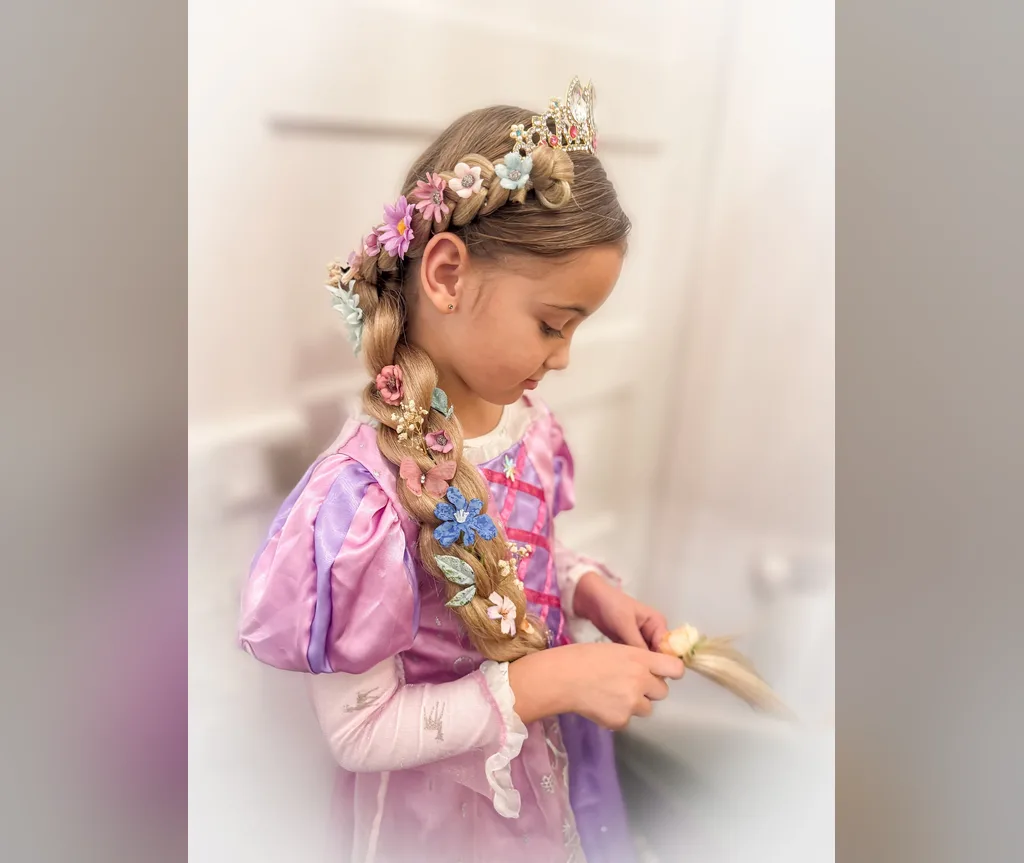 Braid decorated with small flowers and worn with a crown, halloween hairstyles for girls