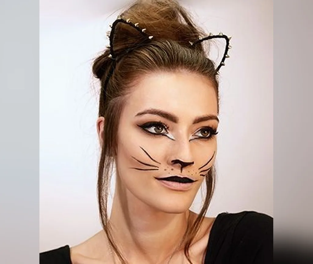 Wire cat ear headband with a soft messy bun and cat makeup, gentle easy halloween hairstyle