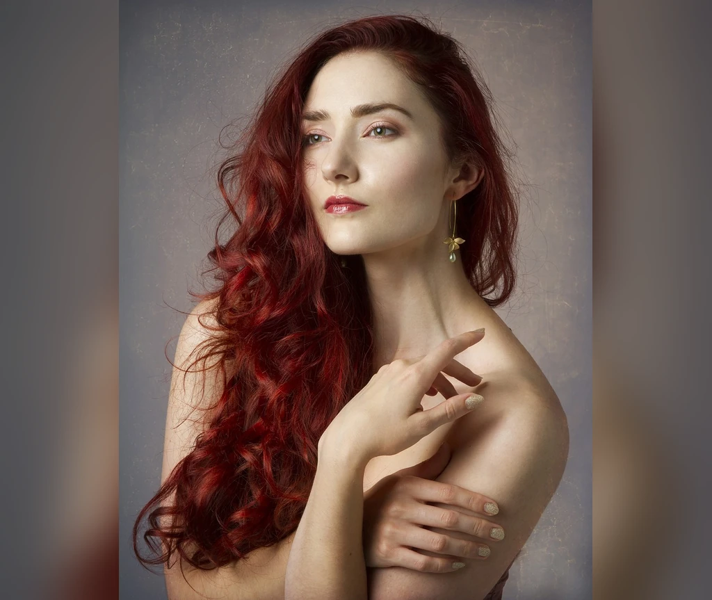 Soft red curls with vintage grace