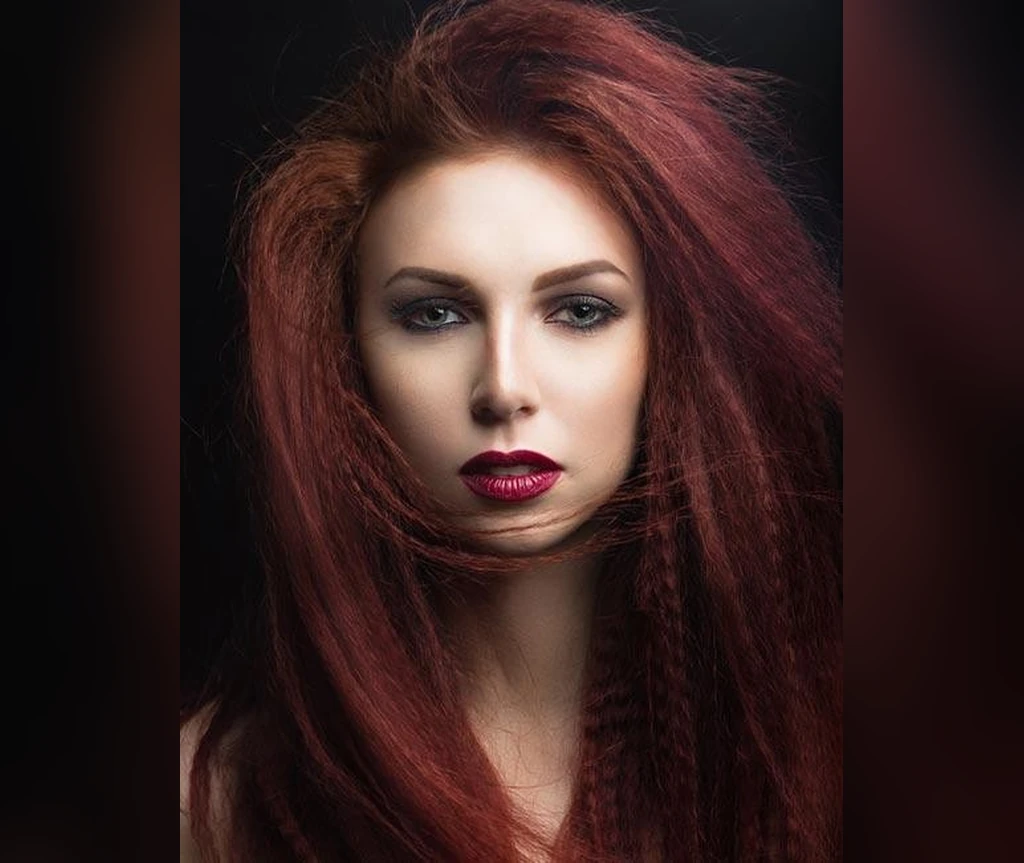 Fiery red vampire hair with dramatic volume