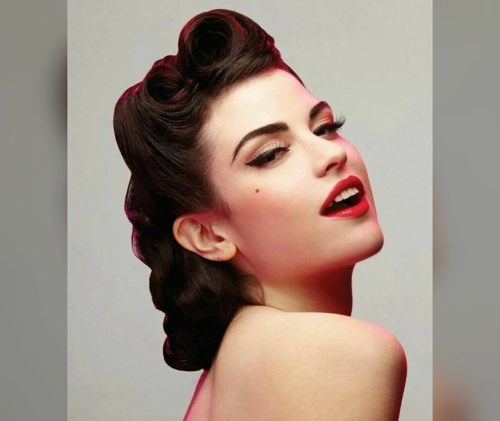 Retro rolls hairstyle in profile