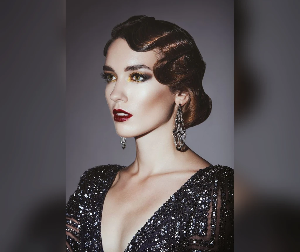 Finger waves with a vintage bun and sequins
