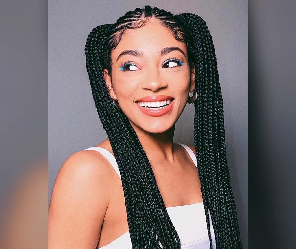 Ghana braids into two ponytails worn high on both sides