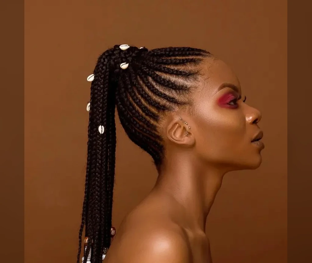 Ghana braids ponytail with shells decorating the lengths