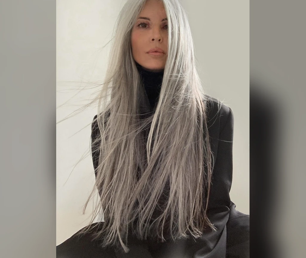 Long straight silver hair worn sleek and long