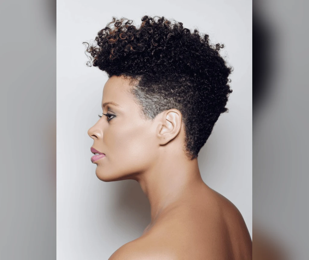 Tapered afro on a Black woman in side profile