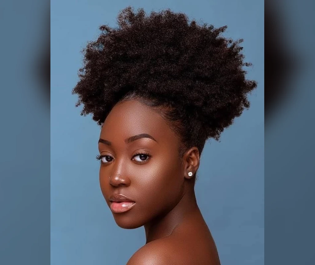 Afro puff in warm brown tones on a Black woman