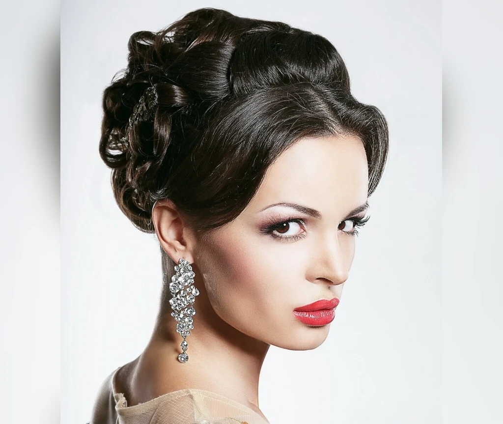 Elaborate vampire updo with sculpted curls