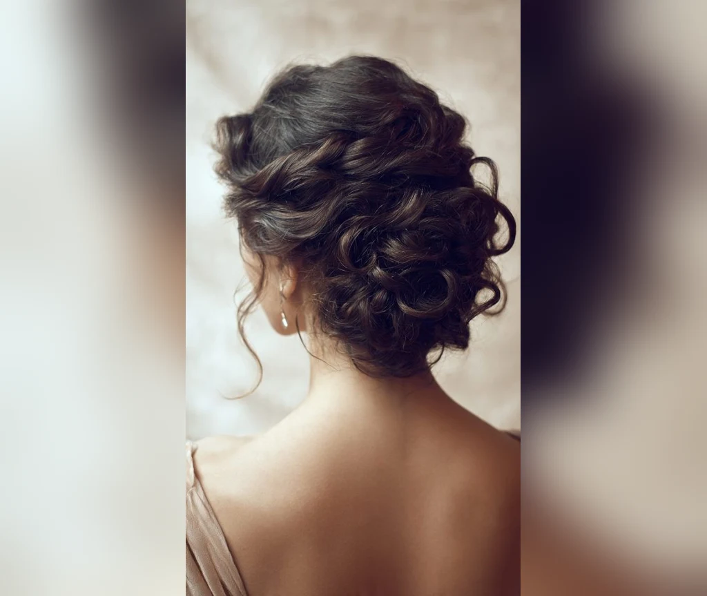 Romantic vampire updo with soft pinned curls