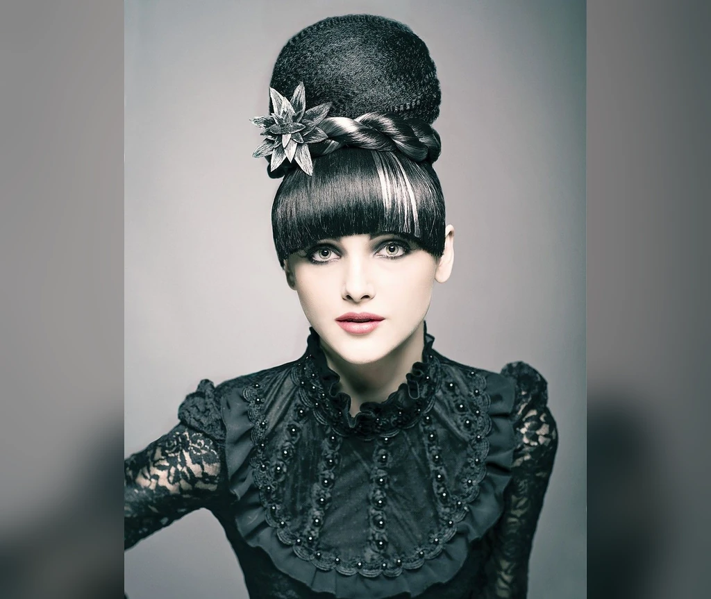 Victorian bun with a dark flower accessory